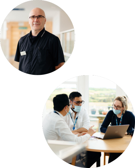 smiling staff working at desks together