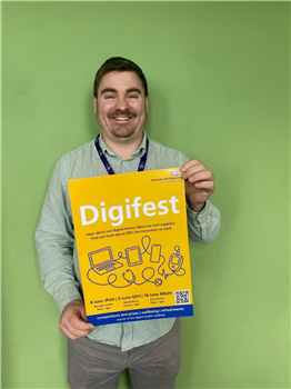Daniel Wade one of the change team with a Digifest poster